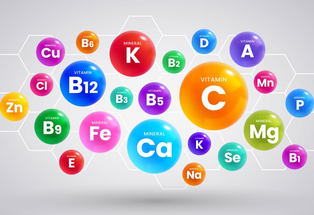 Bunte Symbole für Mineralstoffe wie Calcium, Magnesium, Eisen und Zink auf weißem Hintergrund