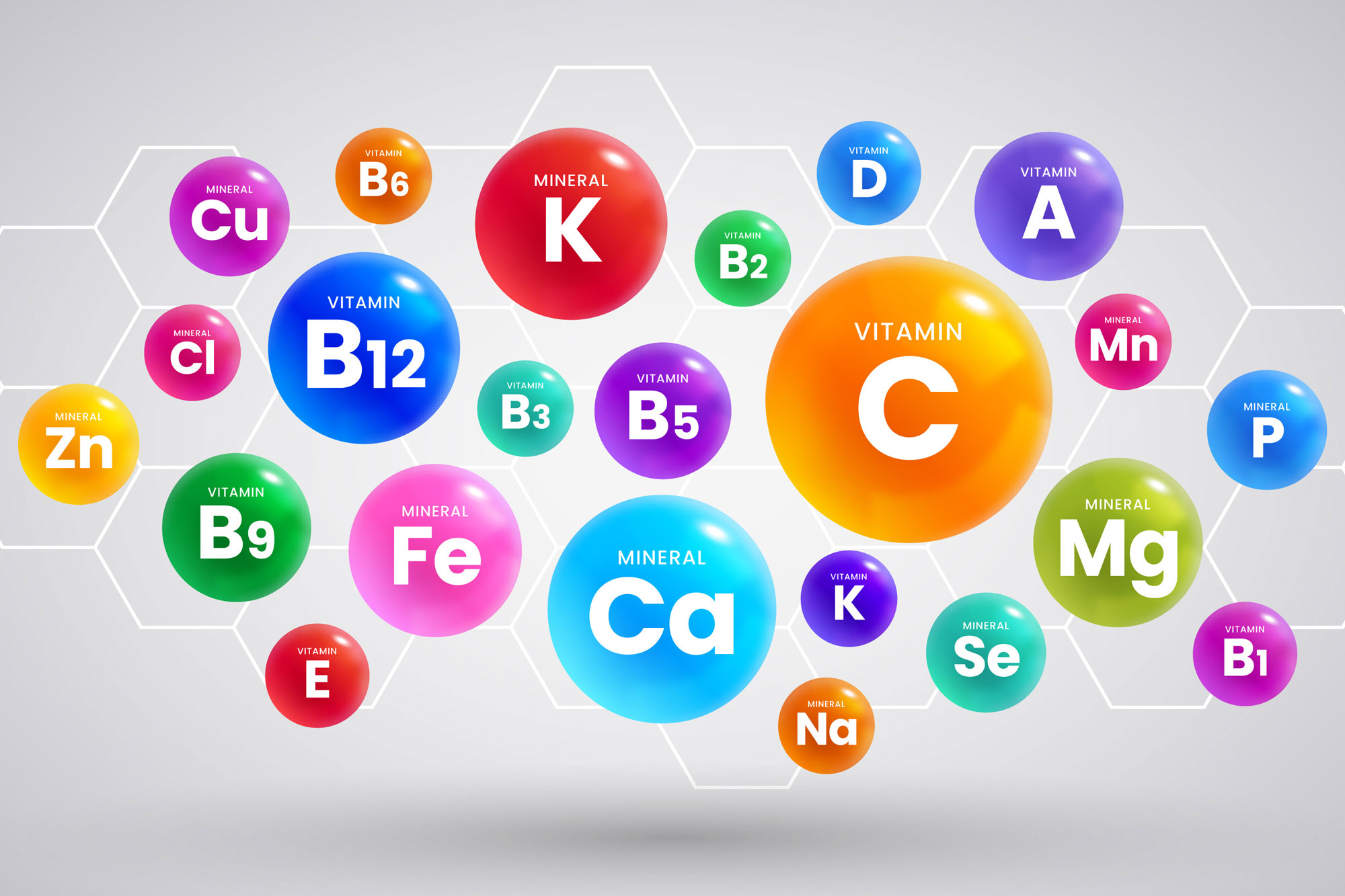 Bunte Symbole für Mineralstoffe wie Calcium, Magnesium, Eisen und Zink auf weißem Hintergrund